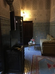 Our sitting room with divan and mosaic tile walls